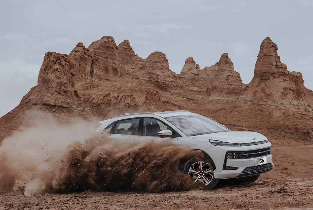 White JAC JS6 Car moving in the sand in Qatar,